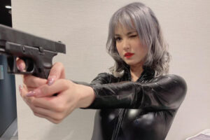 Maria Ozawa pointing toy gun