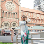 Maria Ozawa poses in front of the Pink Church in Ho Chi Minh City, Vietnm. Maria Ozawa Embraces Vietnamese Culture in Ao Dai While Exploring Ho Chi Minh City's Historic Gems